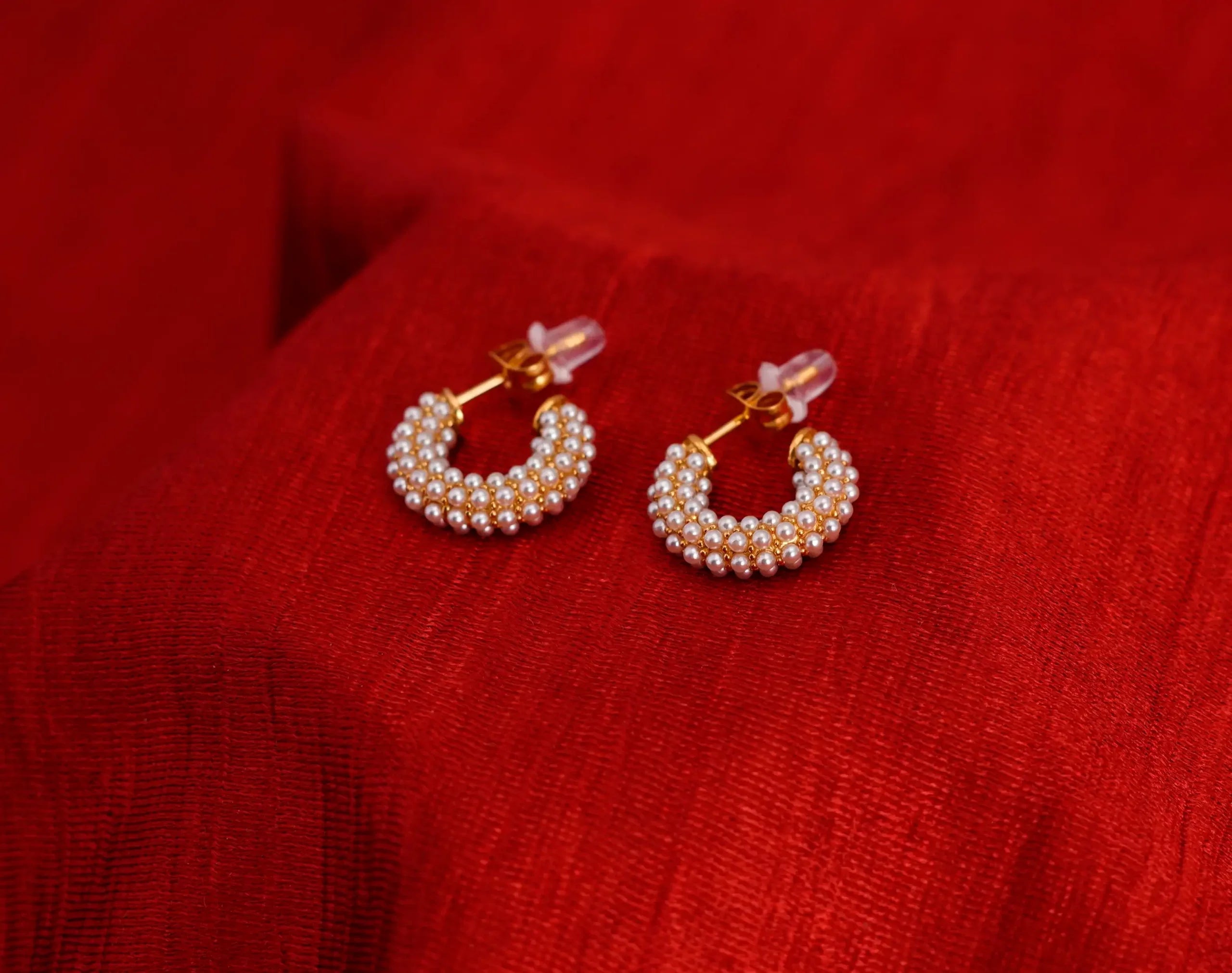 C-shaped pearl earrings