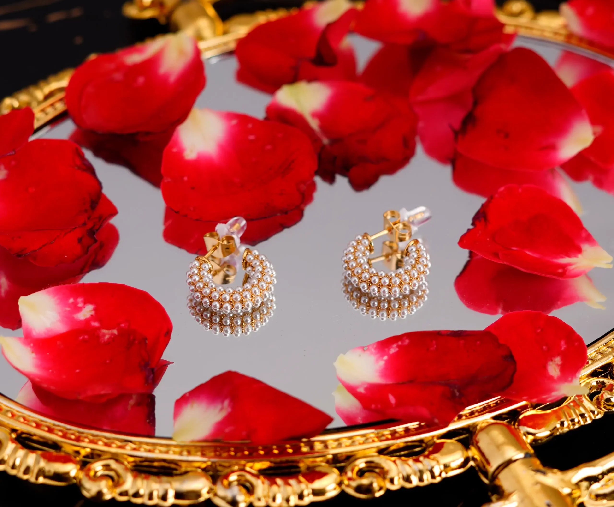 C-shaped pearl earrings