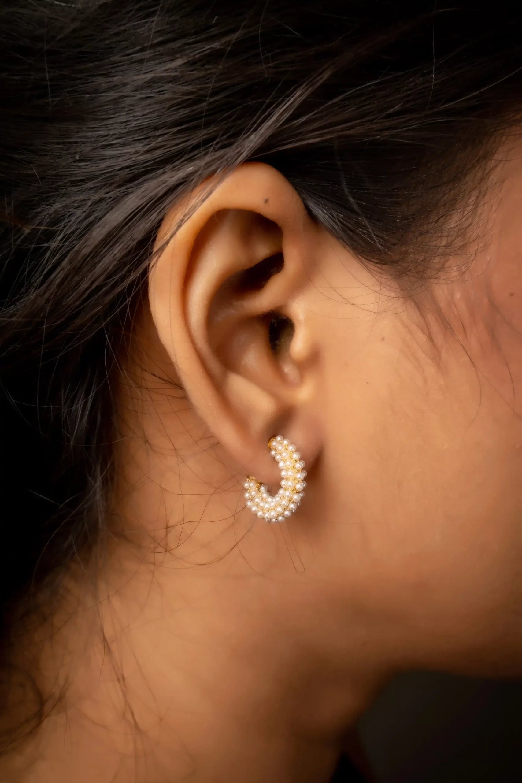 C-shaped pearl earrings