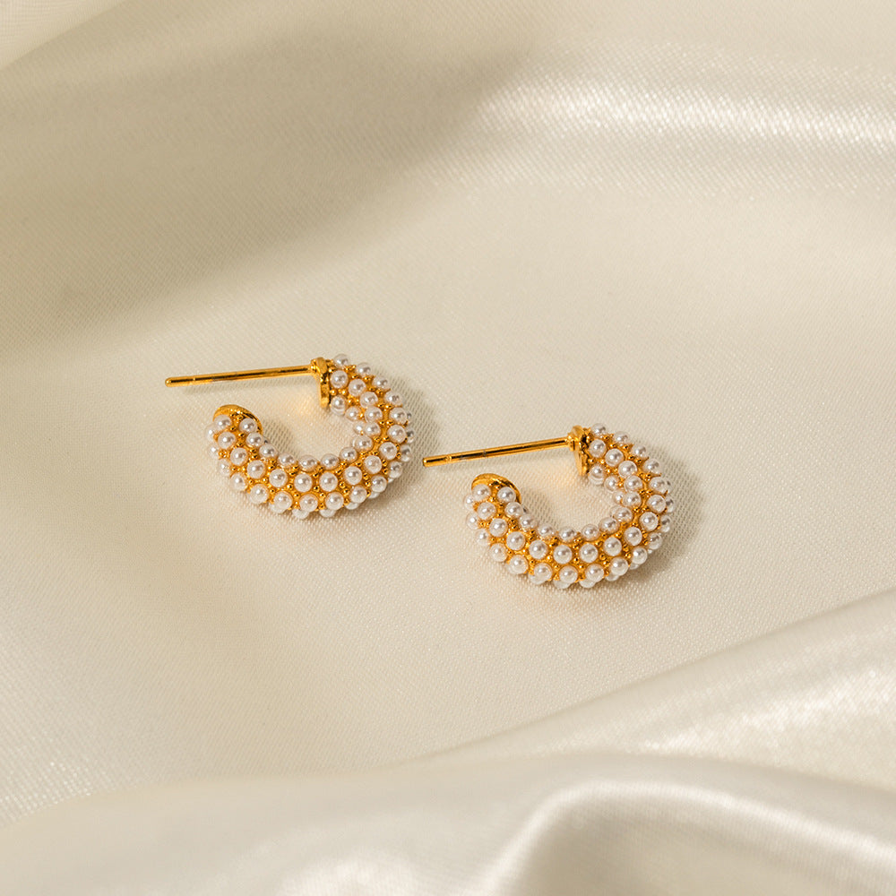 C-shaped pearl earrings
